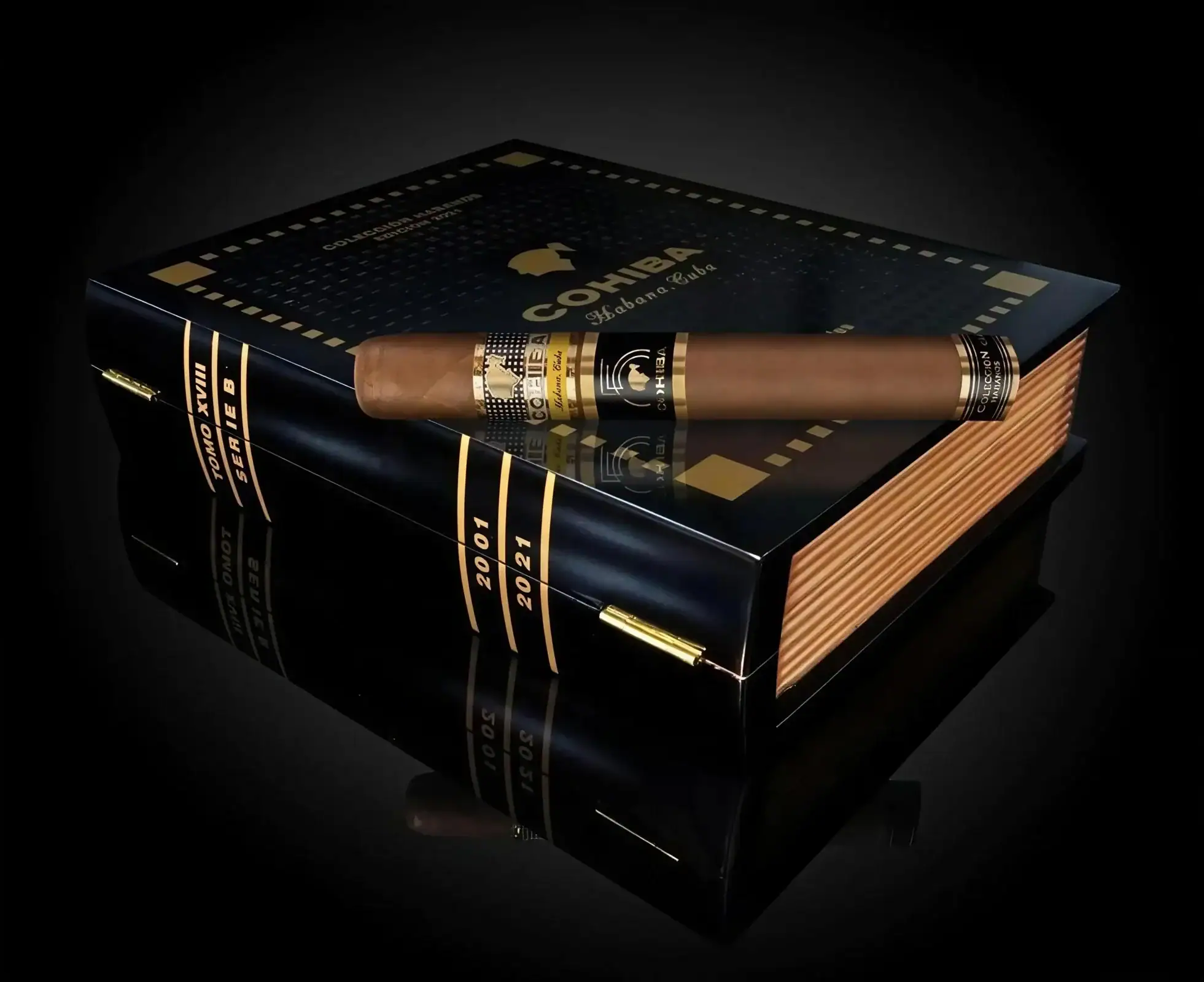 Humidor deschis Cohiba Ideales Collection Book cu un trabuc așezat deasupra celorlalte trabucuri, imagine reprezentativă